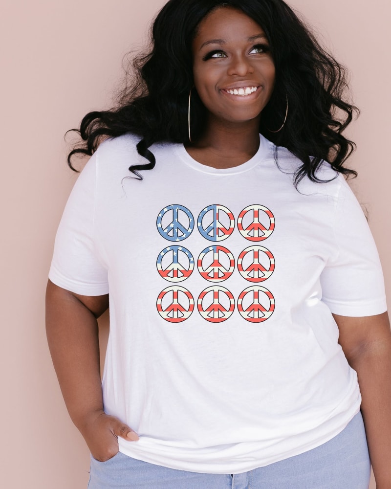 Front of a model wearing a size 2XL Peace Signs Flag in White by Simply Sage Market. | dia_product_style_image_id:281541